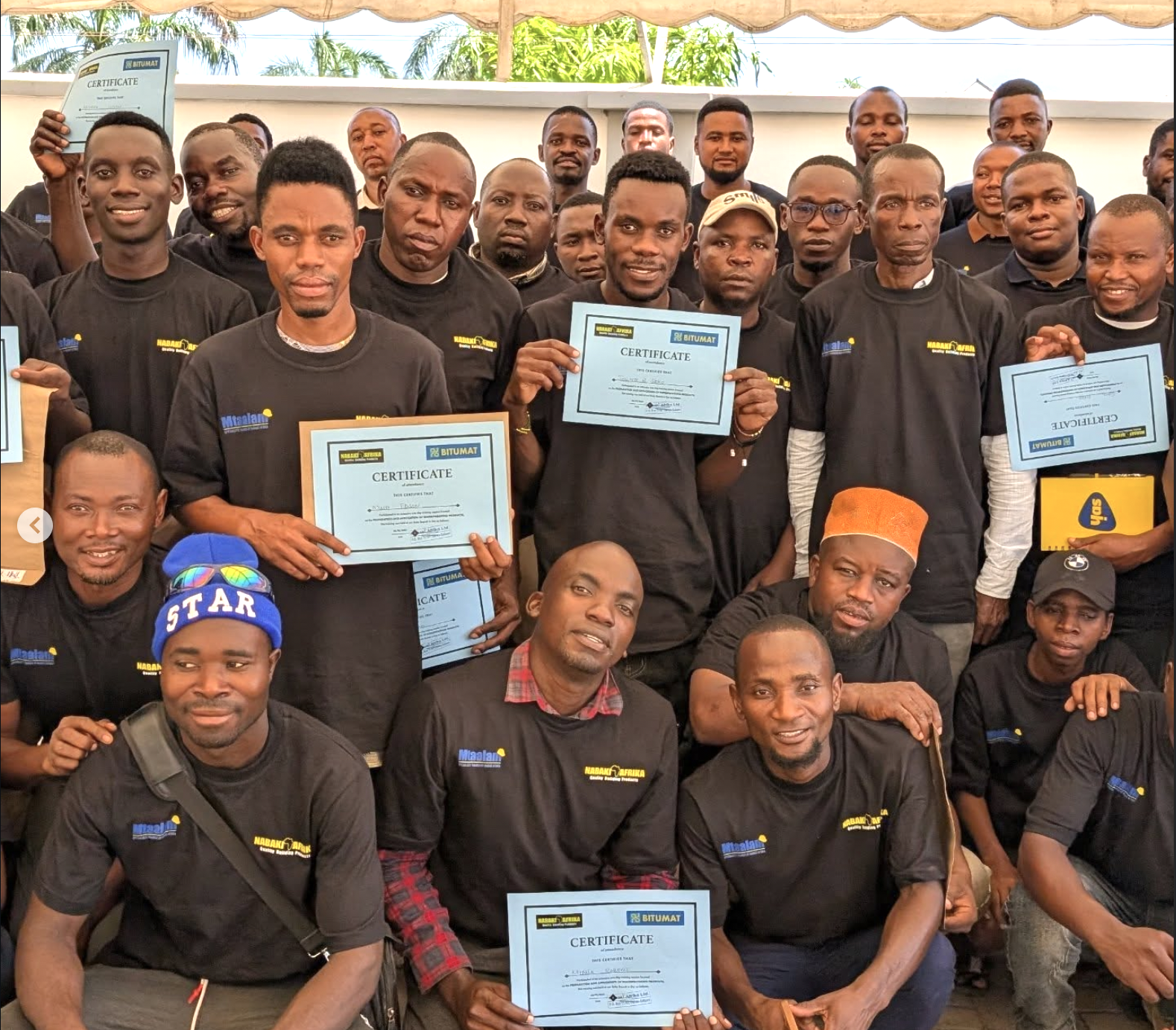 Nabaki Mtaalam graduates holding training certificates